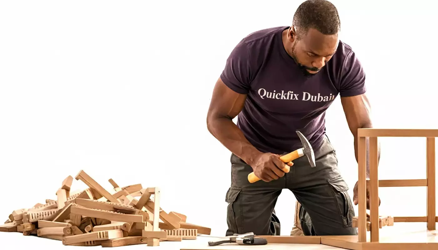 Highly skilled handyman diligently assembling furniture with precision and care.